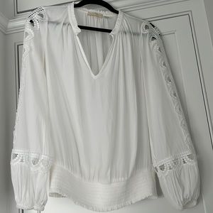 Can be worn open or closed to make a key hole. Lace cut out details on sleeve.